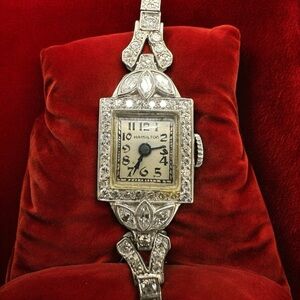 Hamilton women’s Watch. 59 natural Diamonds, Platinum case, 14K gold band